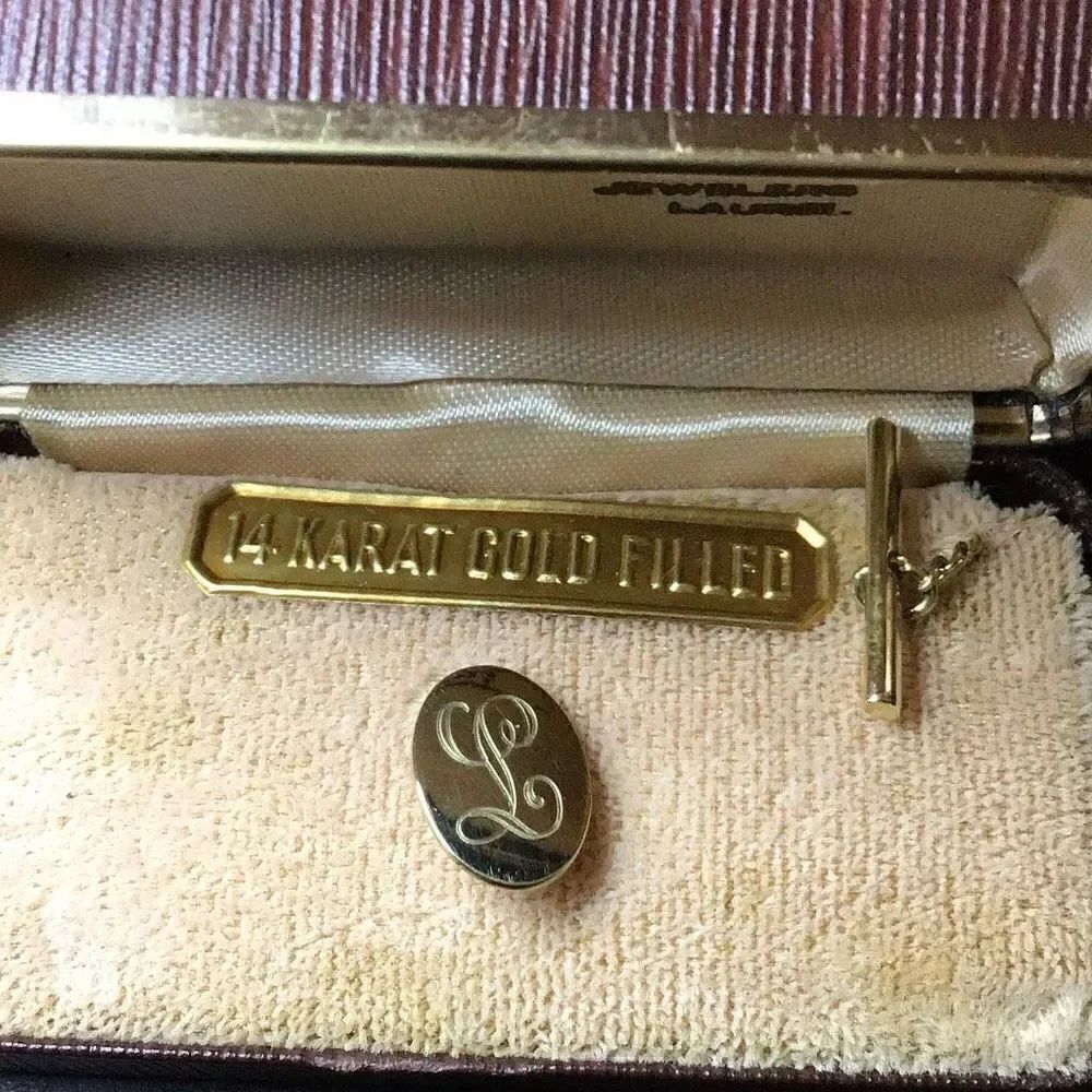 Tie tac 12 k gold filled by Burtons with initial “L”